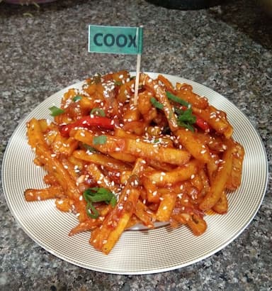 Tasty Honey Chilli Potato cooked by COOX chefs cooks during occasions parties events at home