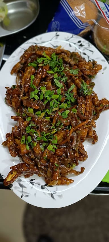 Tasty Crispy Chilli Baby Corn cooked by COOX chefs cooks during occasions parties events at home