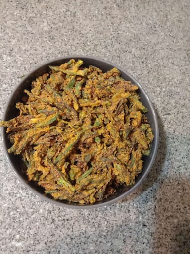 Tasty Kurkuri Bhindi cooked by COOX chefs cooks during occasions parties events at home