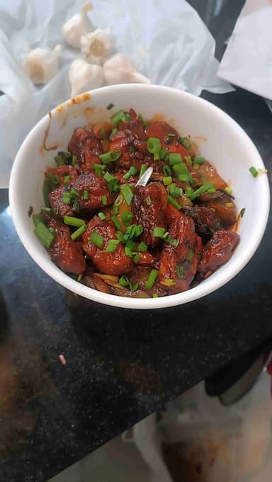 Tasty Chilli Chicken cooked by COOX chefs cooks during occasions parties events at home
