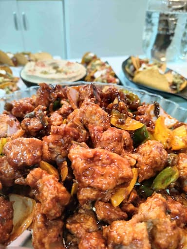 Tasty Chilli Chicken cooked by COOX chefs cooks during occasions parties events at home