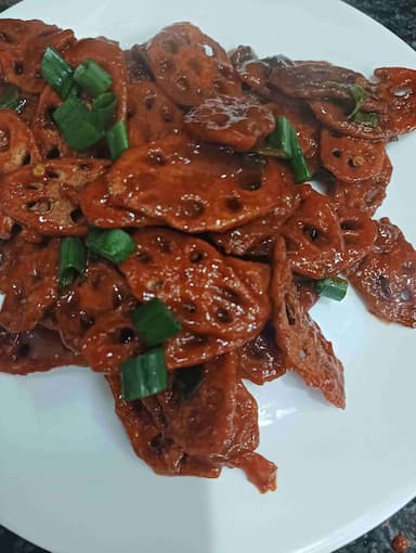Tasty Chilli Lotus Stem cooked by COOX chefs cooks during occasions parties events at home