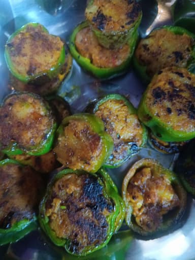 Tasty Bharwa Shimla Mirch cooked by COOX chefs cooks during occasions parties events at home