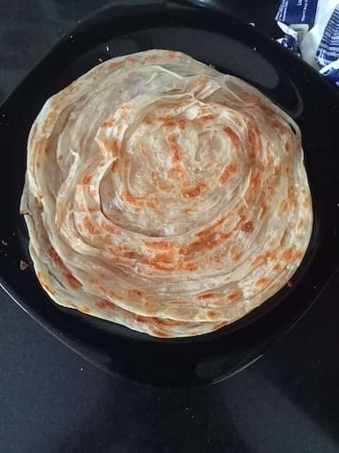 Tasty Malabar Parotta cooked by COOX chefs cooks during occasions parties events at home