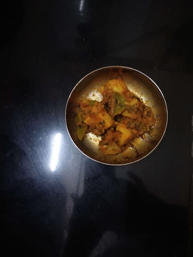 Tasty Aloo Shimla Mirch cooked by COOX chefs cooks during occasions parties events at home