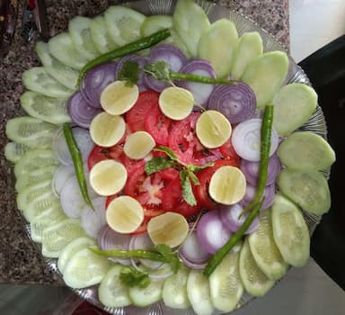 Delicious Salad, Raita, Papad prepared by COOX