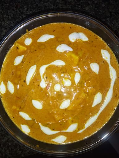 Delicious Paneer Butter Masala prepared by COOX