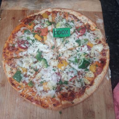 Delicious Veg Pizza prepared by COOX