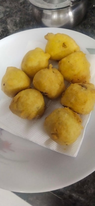Tasty Aloo Bonda cooked by COOX chefs cooks during occasions parties events at home
