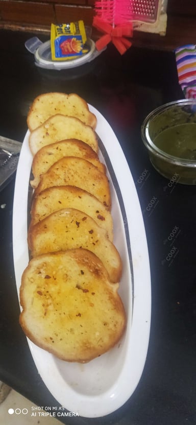 Tasty Garlic Bread with Cheese cooked by COOX chefs cooks during occasions parties events at home