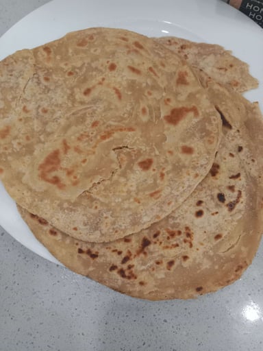 Delicious Lachha Parathas prepared by COOX