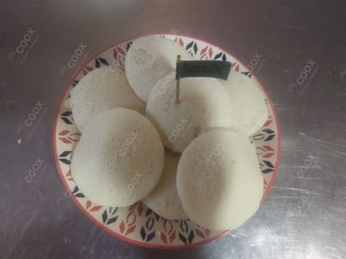 Tasty Plain Idli cooked by COOX chefs cooks during occasions parties events at home