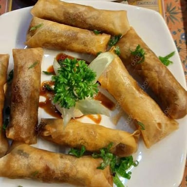 Tasty Veg Spring Rolls cooked by COOX chefs cooks during occasions parties events at home