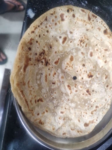 Delicious Lachha Parathas prepared by COOX