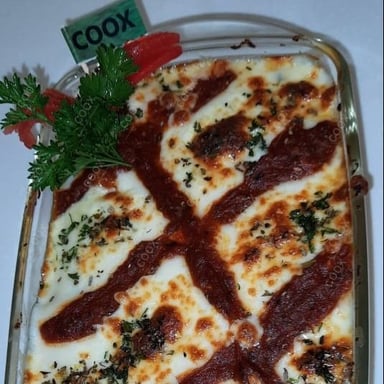 Tasty Chicken Lasagna cooked by COOX chefs cooks during occasions parties events at home