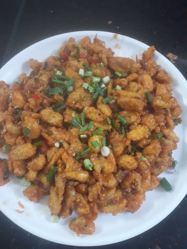 Tasty Crispy Chilli Baby Corn cooked by COOX chefs cooks during occasions parties events at home