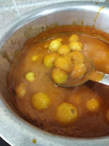 Delicious Dum Aloo prepared by COOX