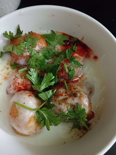 Delicious Dahi Bhalla prepared by COOX