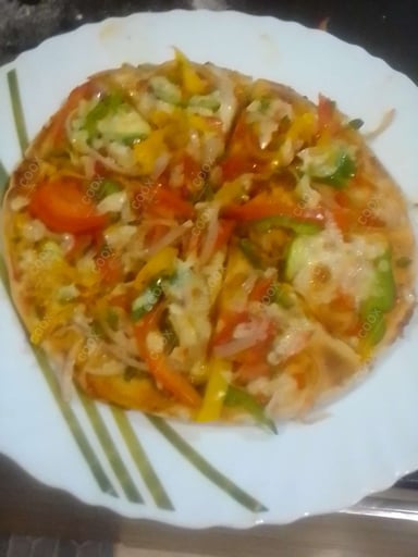 Delicious Veg Pizza prepared by COOX