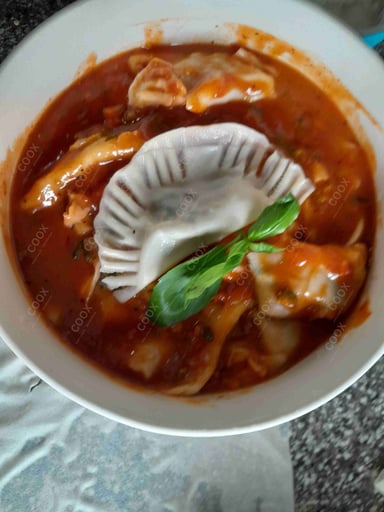 Delicious Ravioli in Pink Sauce prepared by COOX