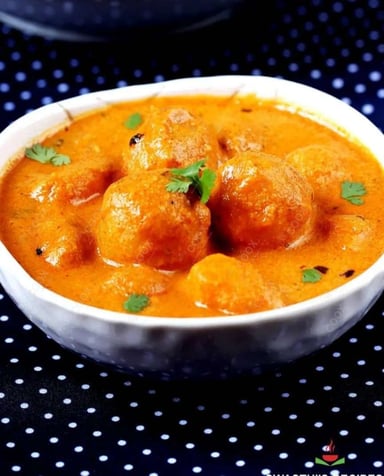 Delicious Dum Aloo prepared by COOX