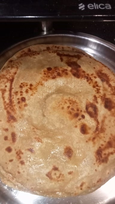 Delicious Lachha Parathas prepared by COOX