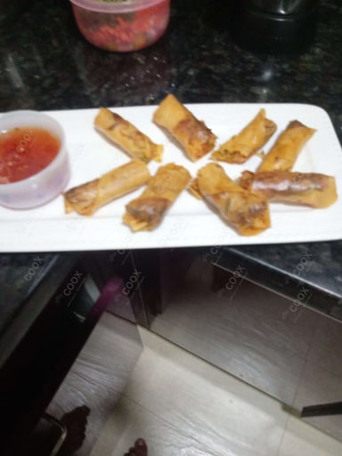 Delicious Veg Spring Rolls prepared by COOX