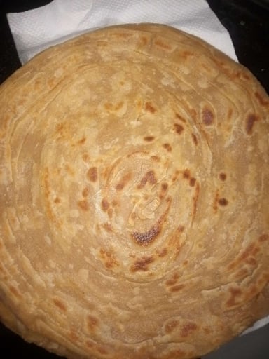 Delicious Lachha Parathas prepared by COOX