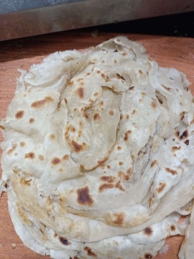 Delicious Lachha Parathas prepared by COOX