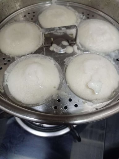 Tasty Plain Idli cooked by COOX chefs cooks during occasions parties events at home