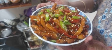 Delicious Honey Chilli Potato prepared by COOX