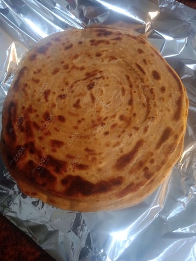 Delicious Lachha Parathas prepared by COOX