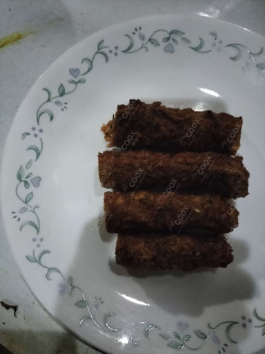 Delicious Mutton Seekh Kebab prepared by COOX