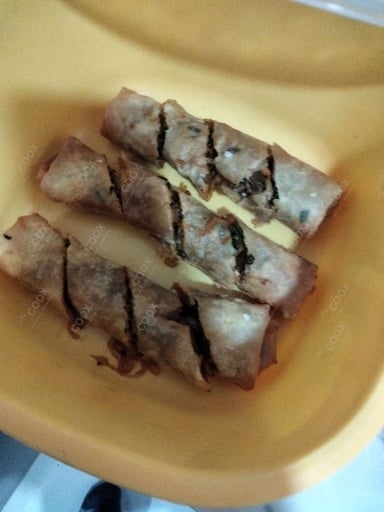 Delicious Veg Spring Rolls prepared by COOX