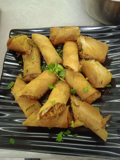 Delicious Veg Spring Rolls prepared by COOX