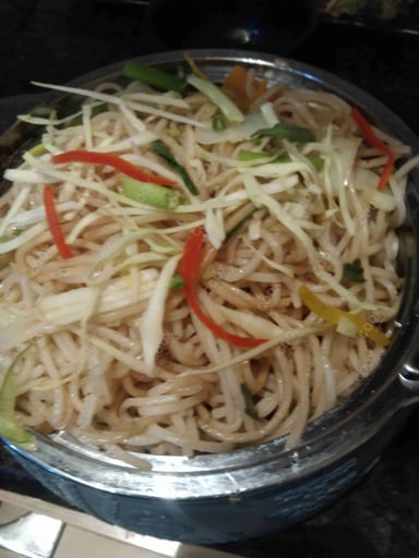 Delicious Veg Hakka Noodles prepared by COOX