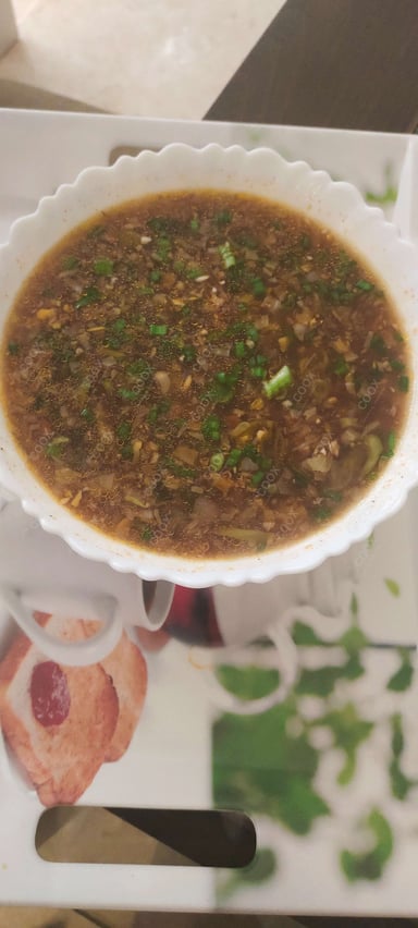 Delicious Vegetable Manchow Soup prepared by COOX