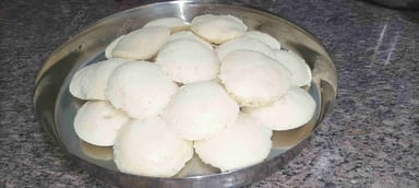 Tasty Plain Idli cooked by COOX chefs cooks during occasions parties events at home