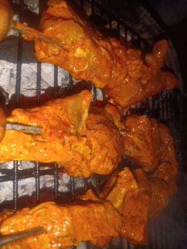 Tasty Tandoori Chicken cooked by COOX chefs cooks during occasions parties events at home