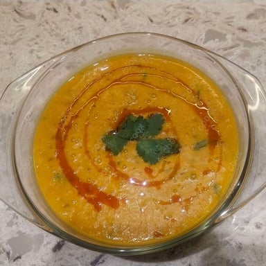 Tasty Dal Tadka cooked by COOX chefs cooks during occasions parties events at home