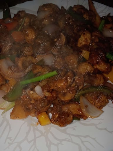 Tasty Chilli Mushroom cooked by COOX chefs cooks during occasions parties events at home