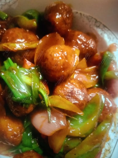 Delicious Veg Manchurian (Dry) prepared by COOX