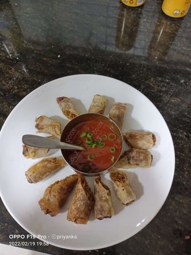 Delicious Veg Spring Rolls prepared by COOX