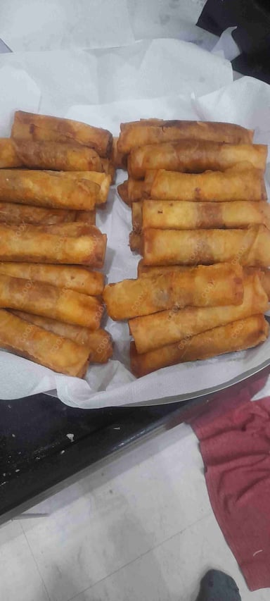 Delicious Veg Spring Rolls prepared by COOX