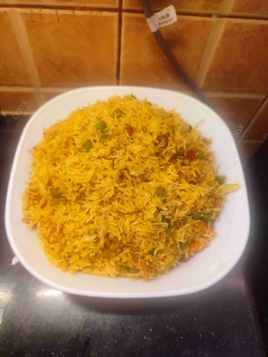 Delicious Veg Biryani prepared by COOX