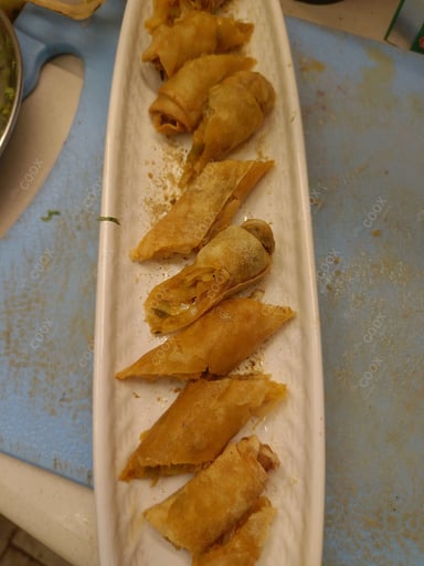 Delicious Veg Spring Rolls prepared by COOX