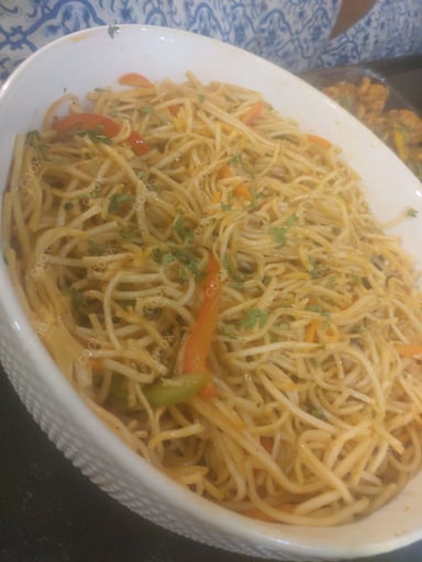 Delicious Veg Hakka Noodles prepared by COOX