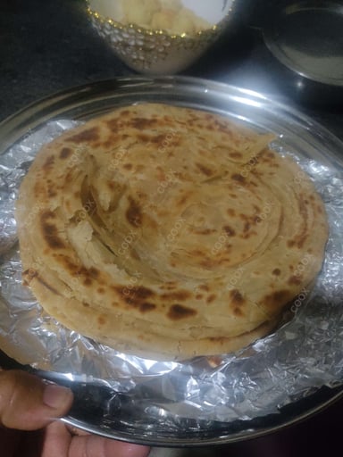 Delicious Lachha Parathas prepared by COOX