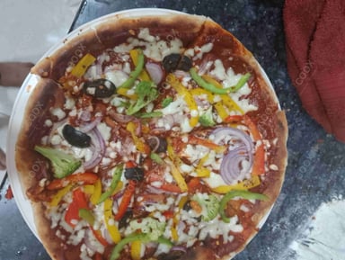 Delicious Veg Pizza prepared by COOX