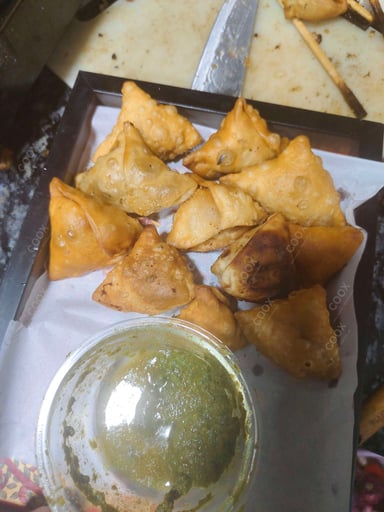 Tasty Keema Samosas cooked by COOX chefs cooks during occasions parties events at home